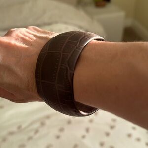 Brown leather bangle.